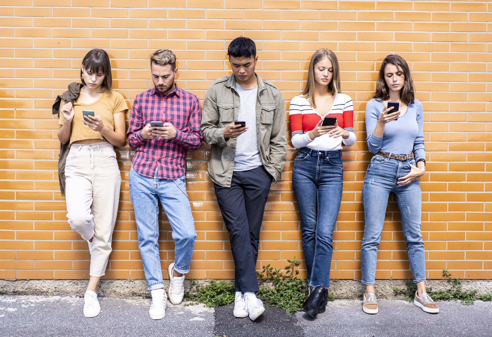 Gen Z looking at their smartphones