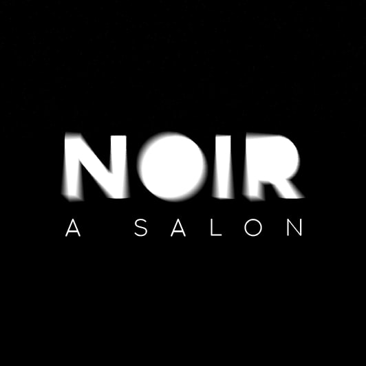 A black and white logo with blurred outline for the letter