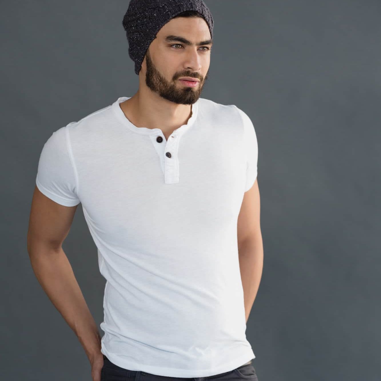 Man posing in white henley T-shirt