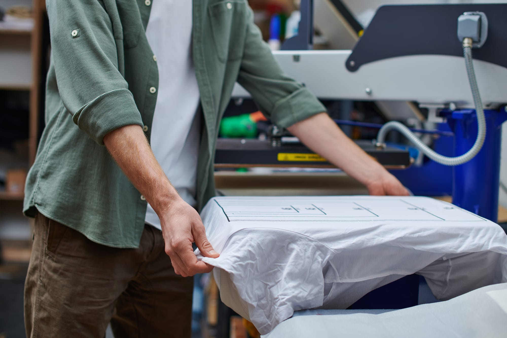 Professional screen printing service printing a design onto a T-shirt
