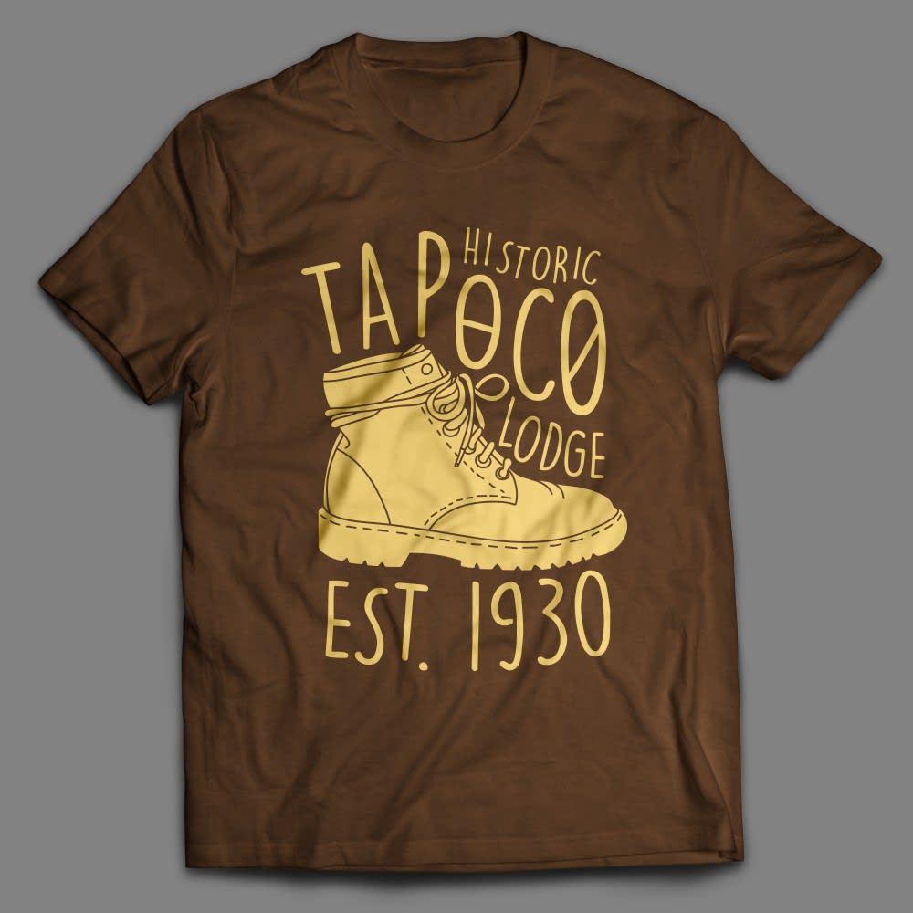 Brown T-shirt with yellow graphic of shoe and font &ldquo;HISTORIC TAPOCO LODGE EST. 1930.&rdquo;