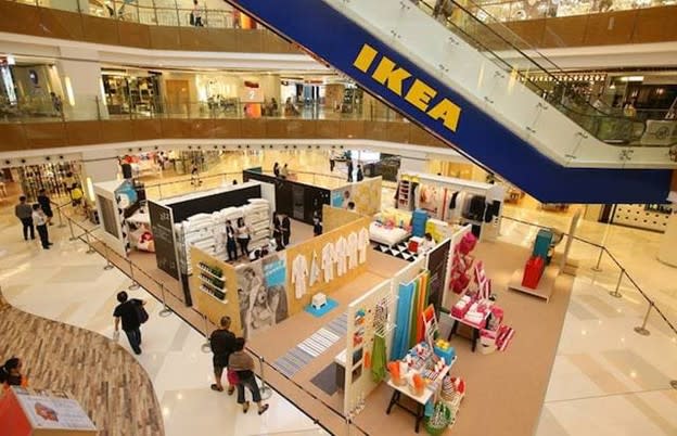 Ikea branding and logo on an escalator in a shopping mall