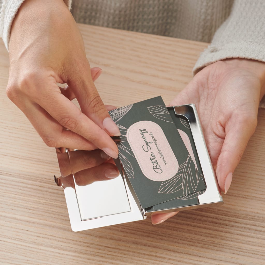 Storing business cards in a metallic card holder is good business card etiquette
