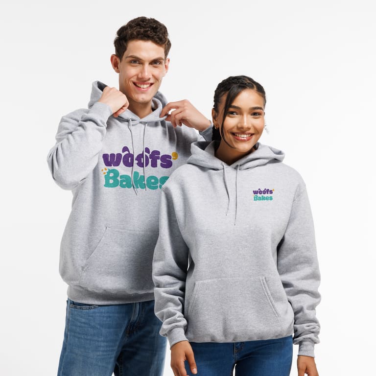 Two people wearing a custom unisex Champion hoodie in grey