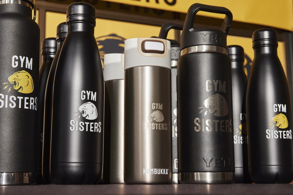 Custom water bottles as branded merchandise for a gym business