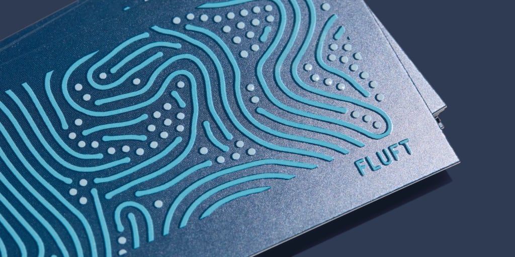 Special embossed finish on business card design.