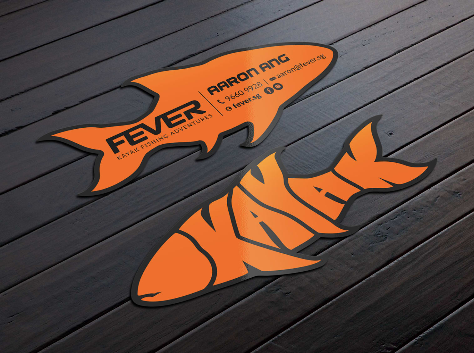 Business cards in the shape of a fish with the Instagram icon.