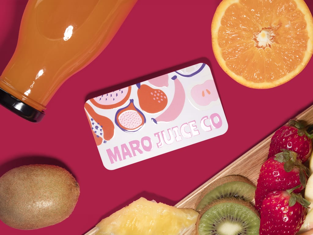 Small business cards for a juice company with a raised embossed gloss finish