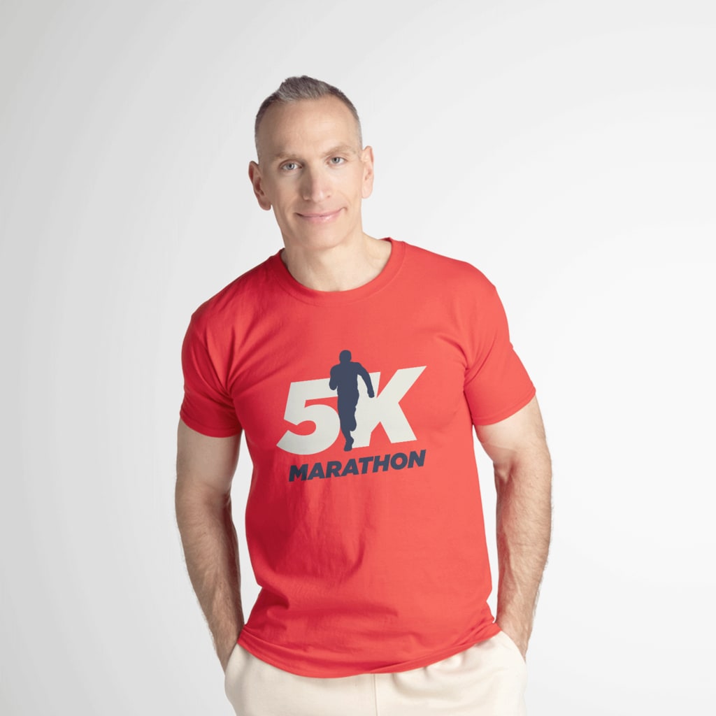 A man wearing a customized red Fruit of the Loom T-shirt