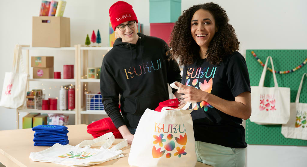 Shop employees wearing branded logo uniforms