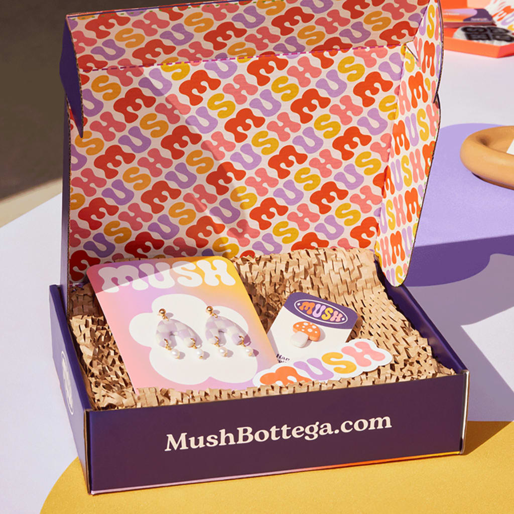 An example of branded packaging with packaging inserts and custom stickers