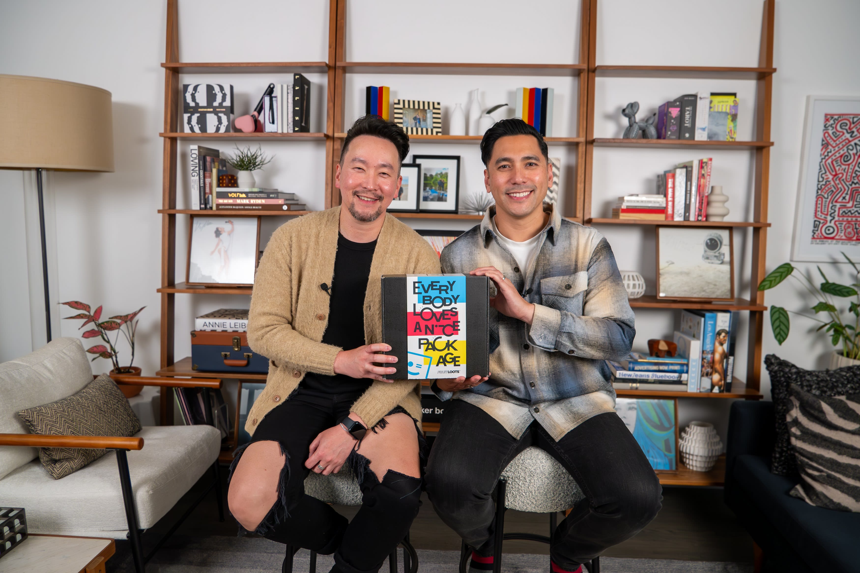 Owners of FRUITLOOTS holding up a custom package.