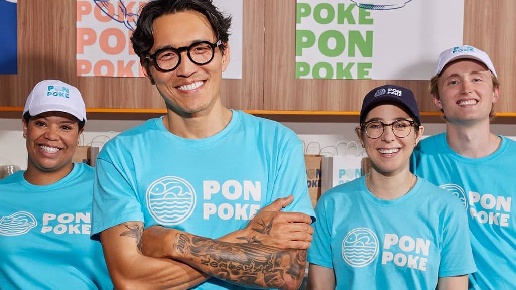 Restaurant employees wearing personalized work uniforms