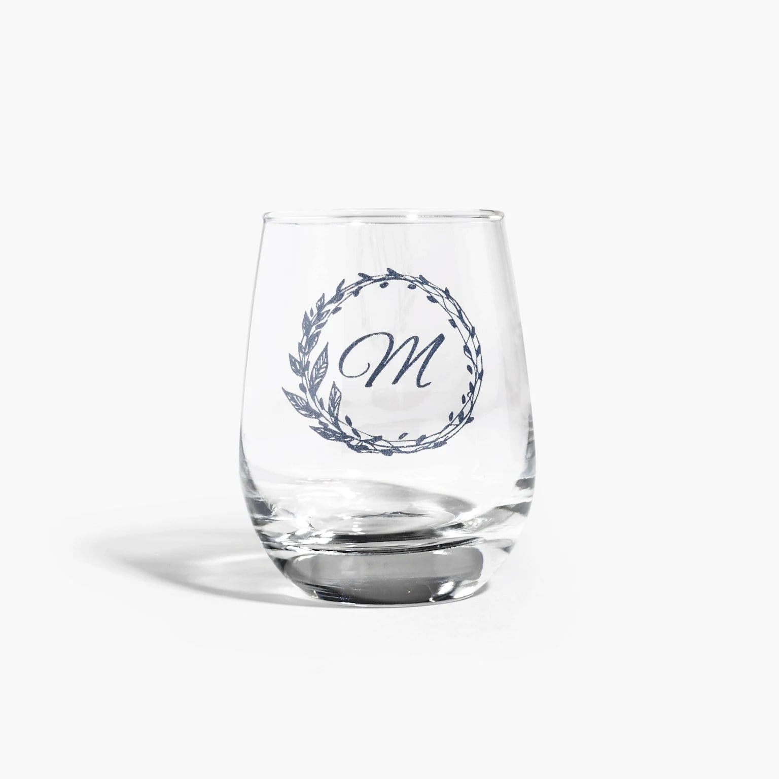 Custom stemless wine glass with initial etched.