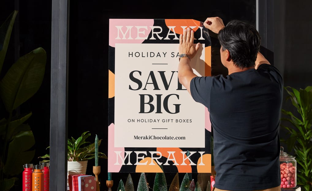 A poster promoting a holiday sale with three different fonts