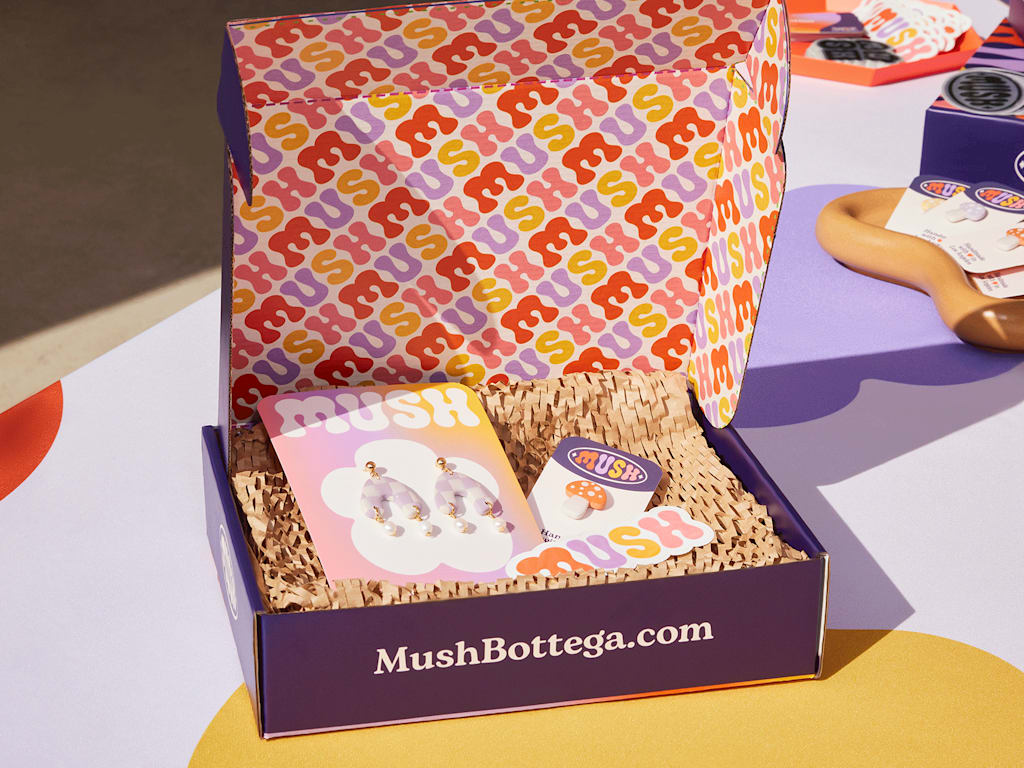 Earrings and other goods inside a brand new box.