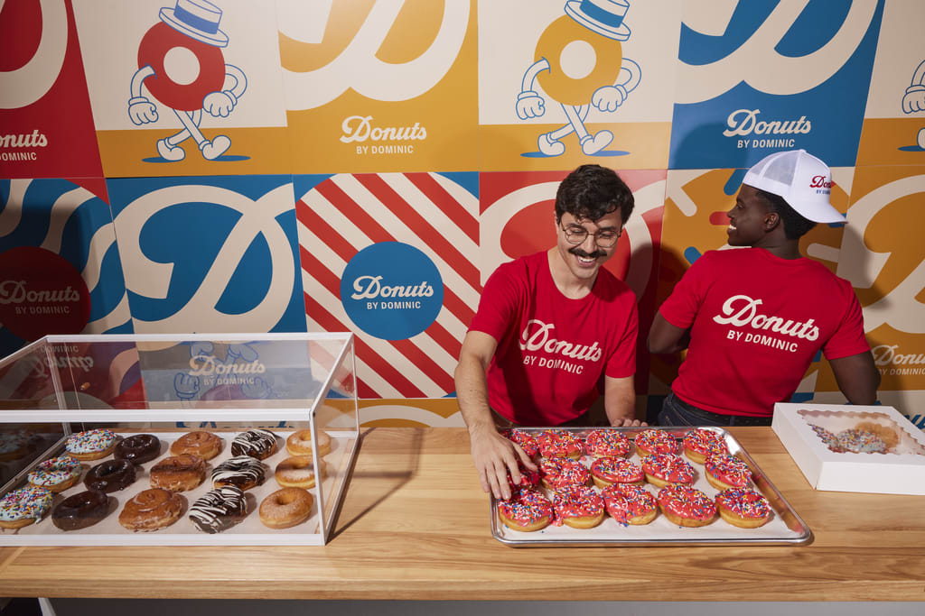 Two men serve Donuts by Dominic