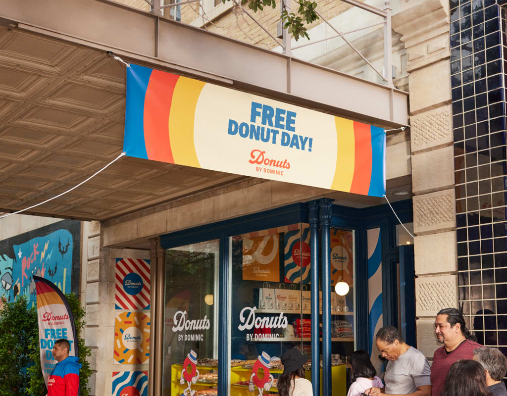 Storefront with free donut day banner