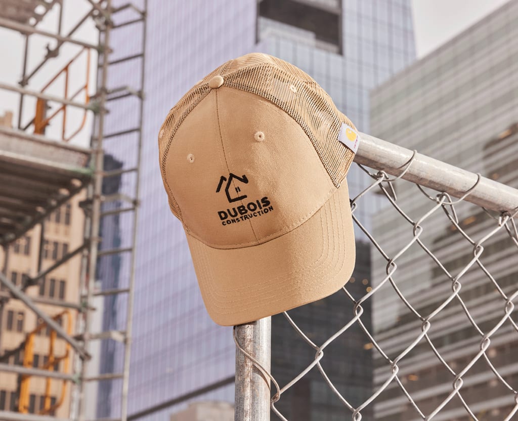Custom brown baseball cap with construction company branding