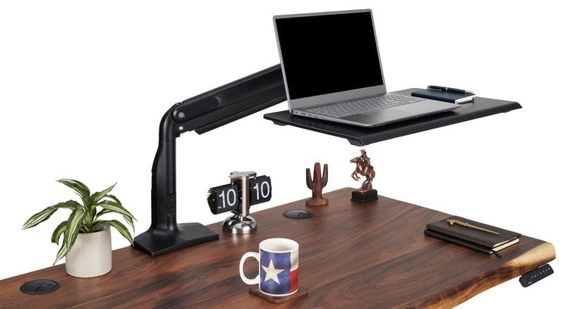 Adjustable laptop tray on a desk