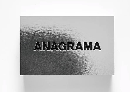 Silver metallic business card with embossed text