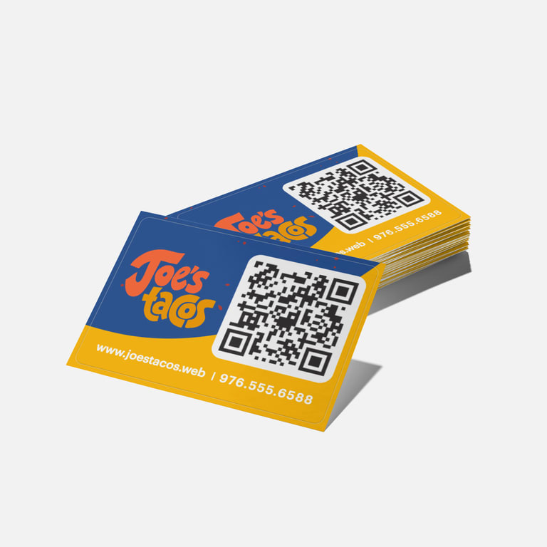 Business card with contrasting yellow and blue blocks, showing how color blocking grabs attention and signals a modern brand style.