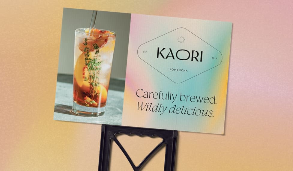Promotional signage for a kombucha business with brand tagline