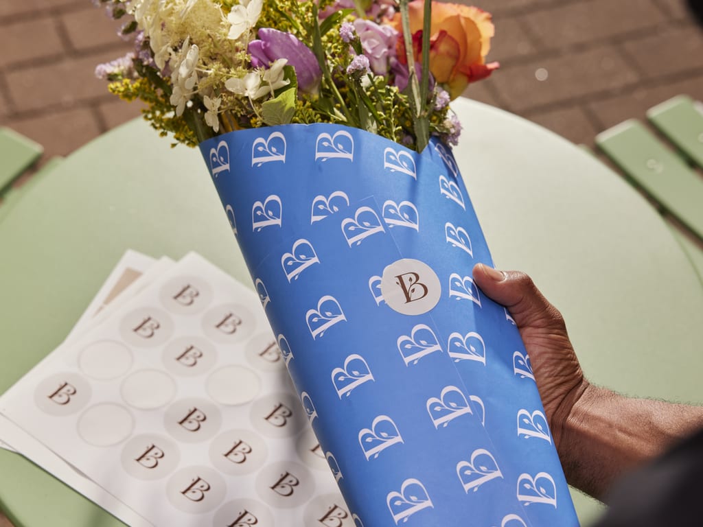 Blue and white minimalism branding on paper wrapping for an independent flower company