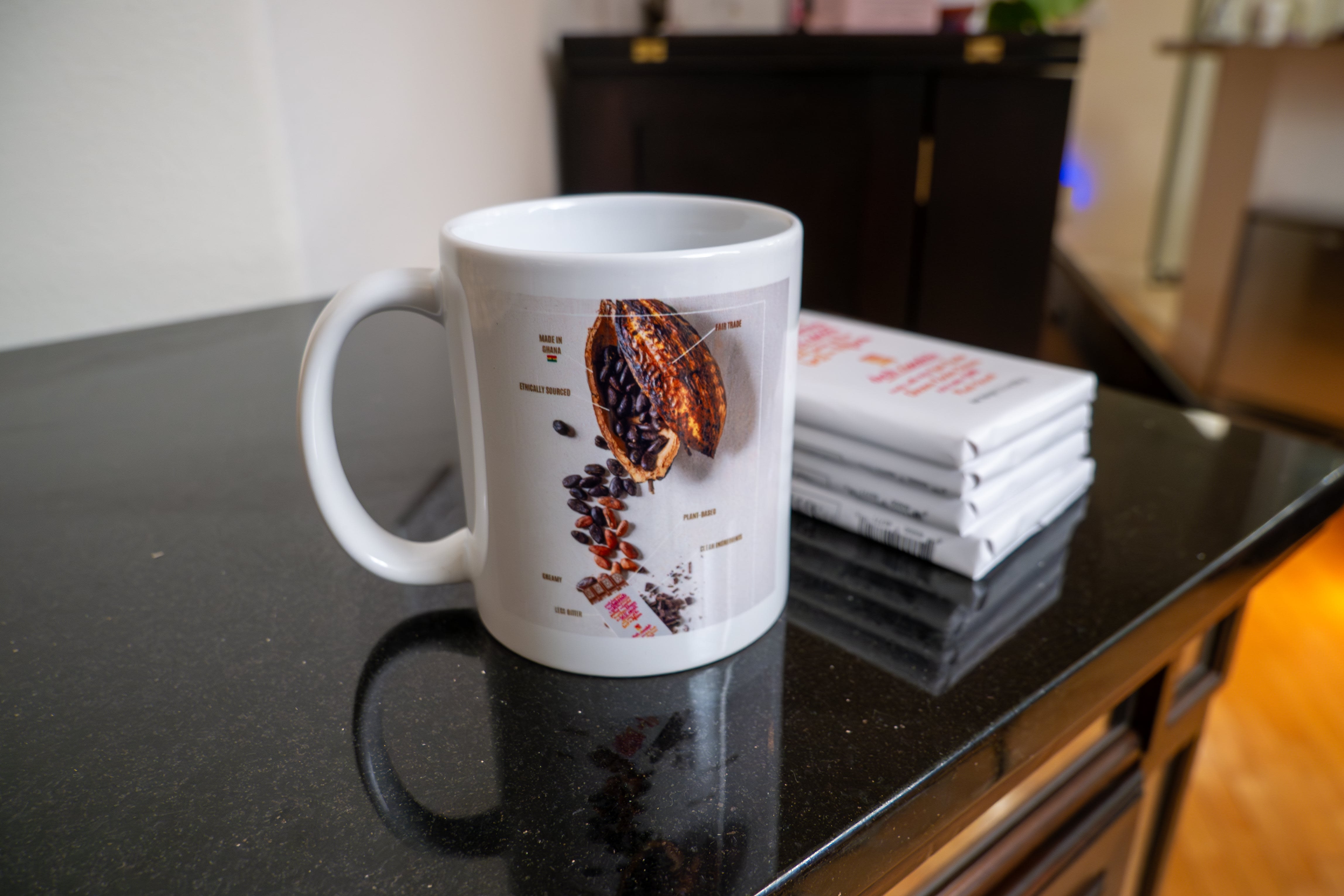 Kanda Chocolate branded mugs that use brand photography, typography, and align with the brand mission statement