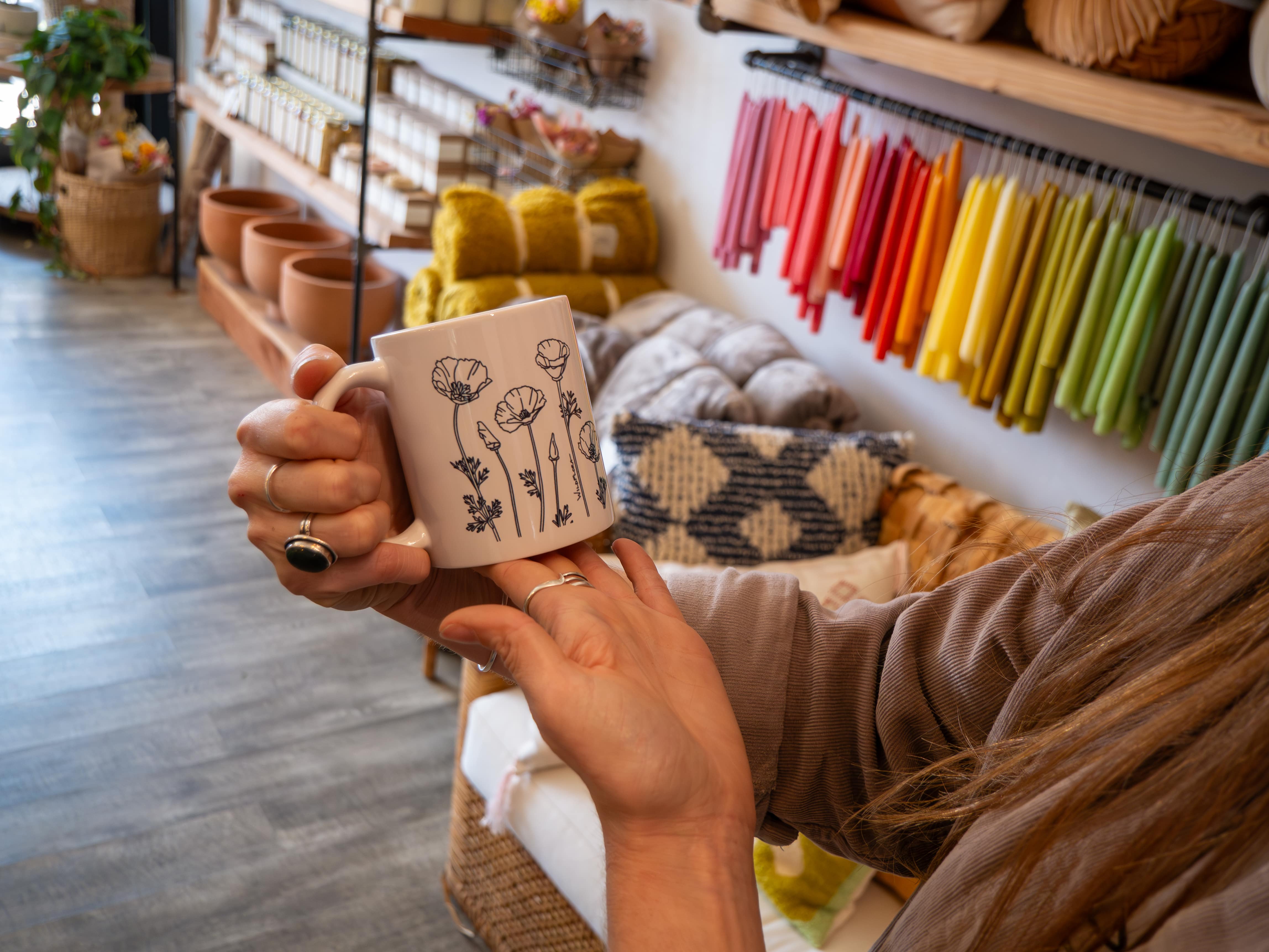 Custom piece of branded merchandise by WildFlora, a mug that uses brand style guide-approved floral illustrations