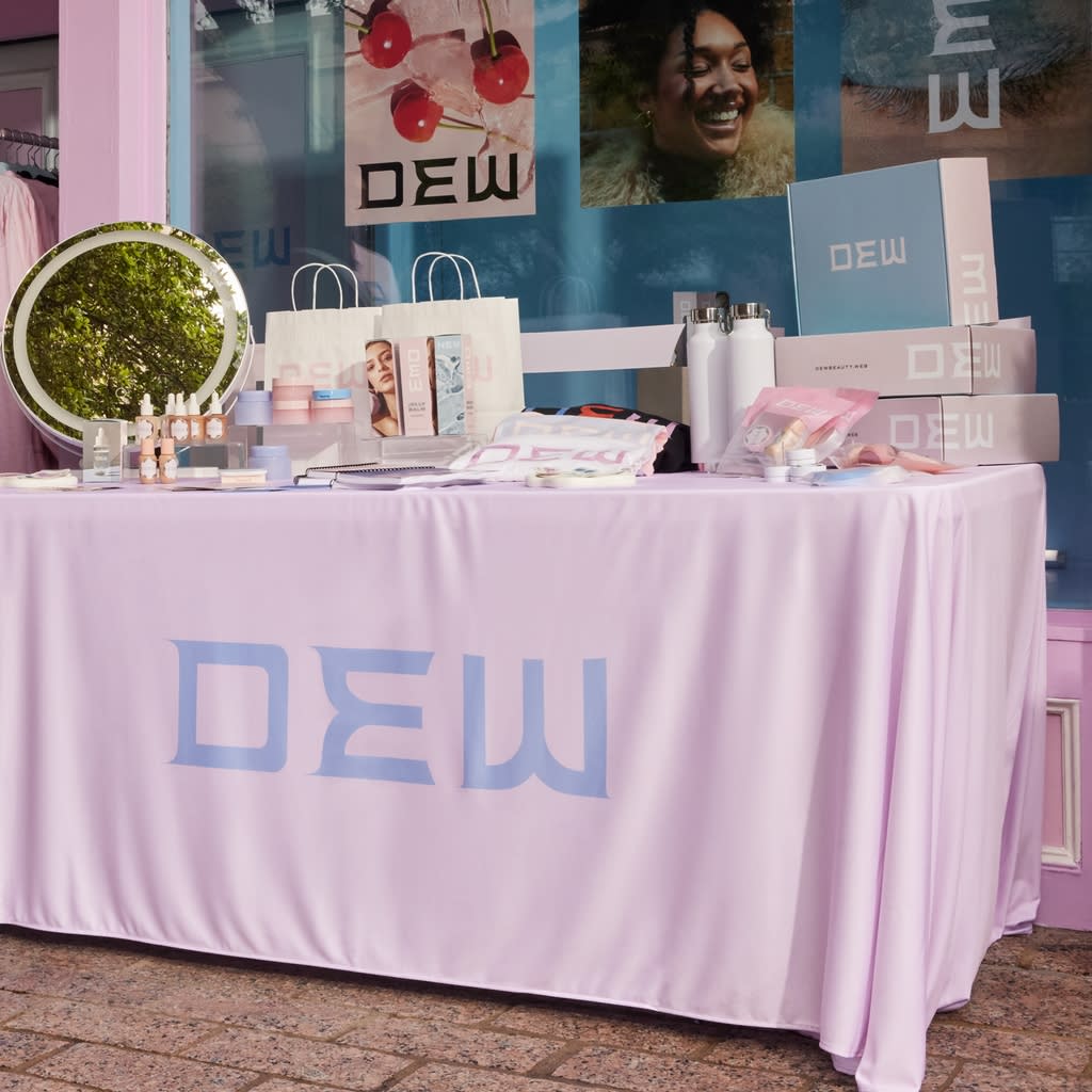 A business conference stall set up for a cosmetics brand