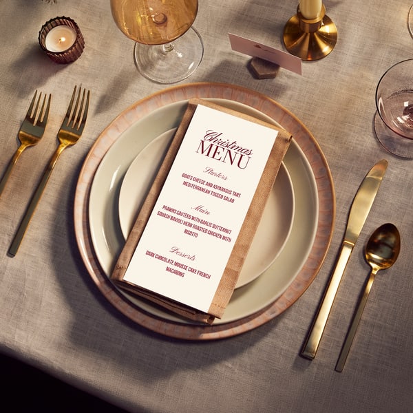 A custom Christmas menu outlining starters, main and desserts for a holiday party