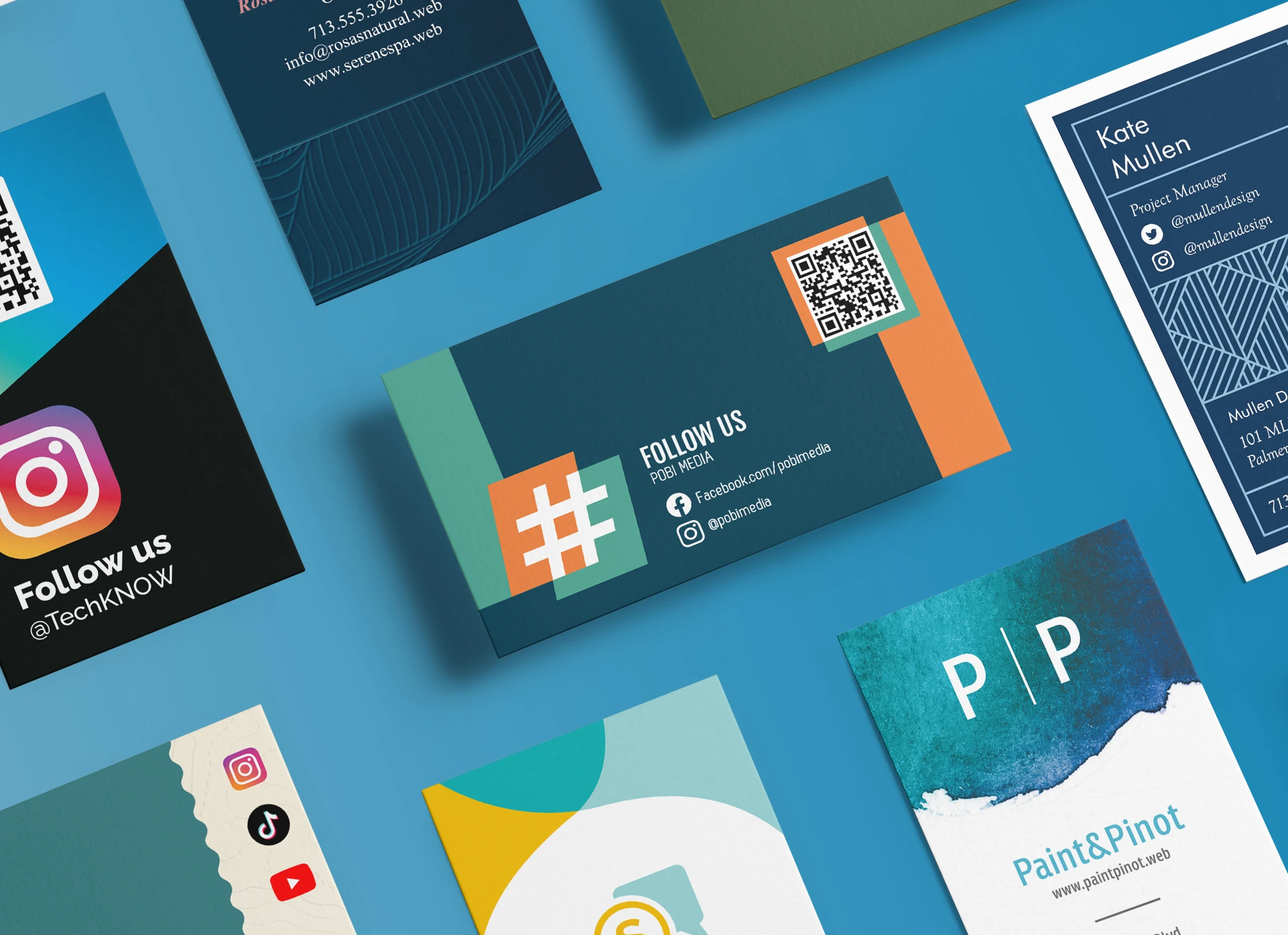 Assorted business card designs on a blue background, including cards with QR codes, social media icons and bold graphic layouts.