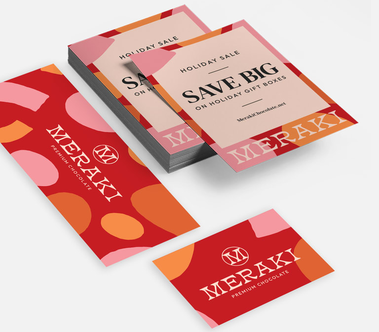 A set of red and pink branded print marketing materials promoting a sale