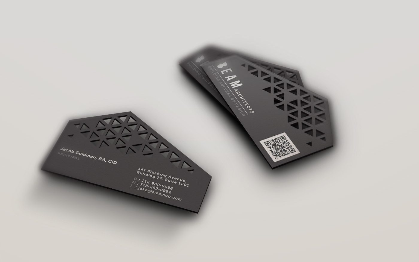 uniquely shaped business card featuring an edged top and cutout squares
