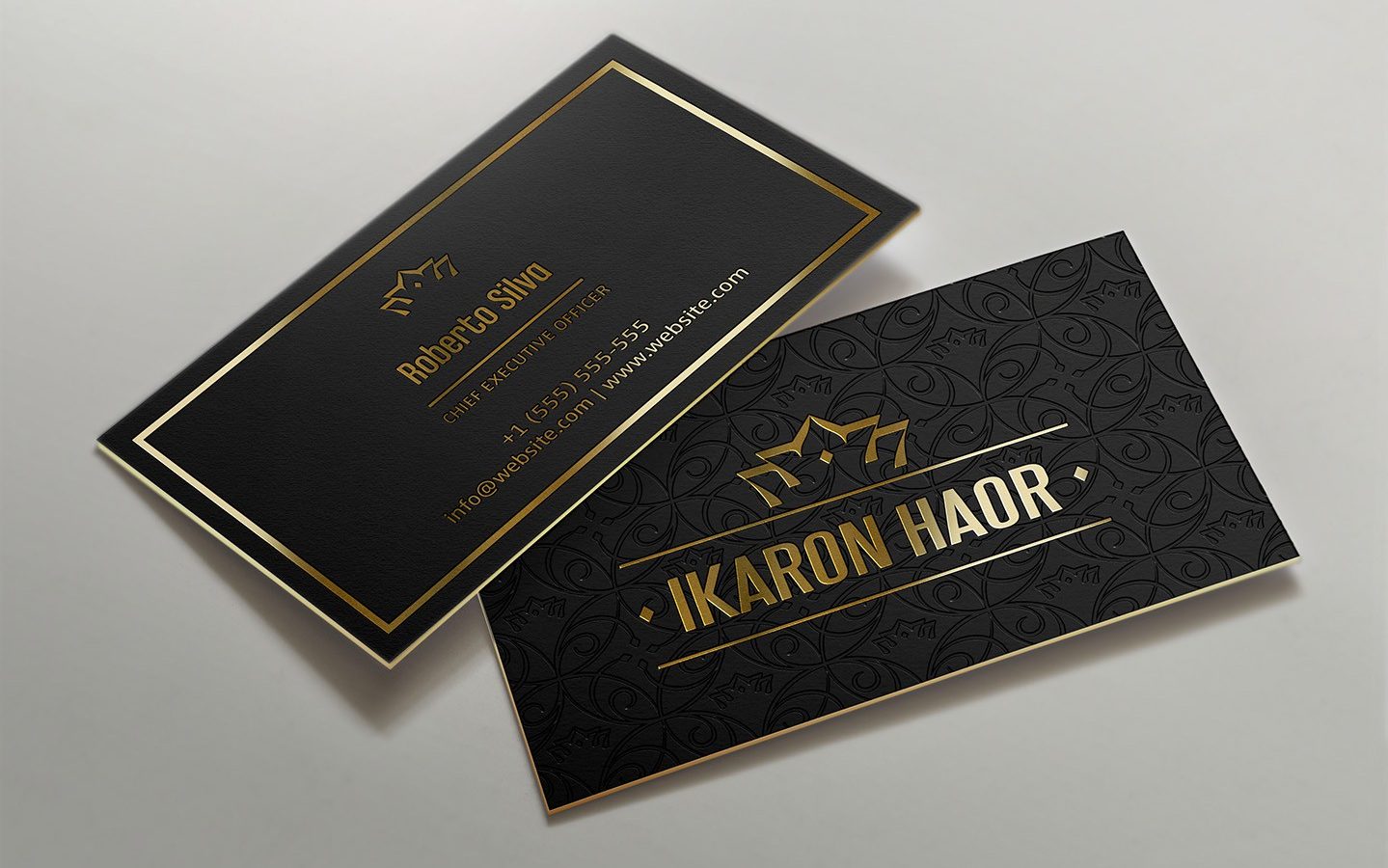 black business card with gold text and a gold printed edge