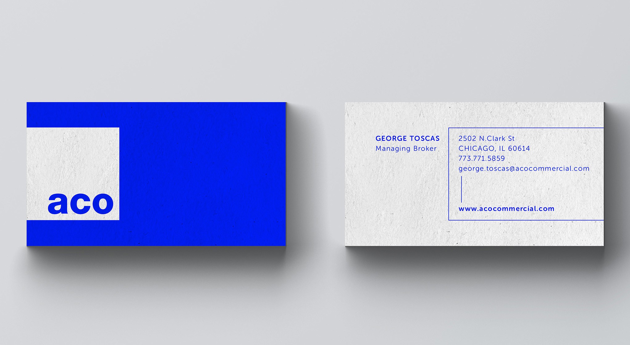 Real estate business card with bold blue color palette
