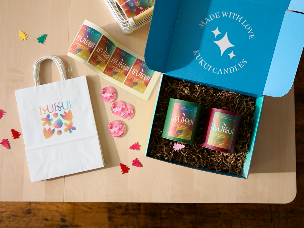 Branded candles in a holiday gift basket