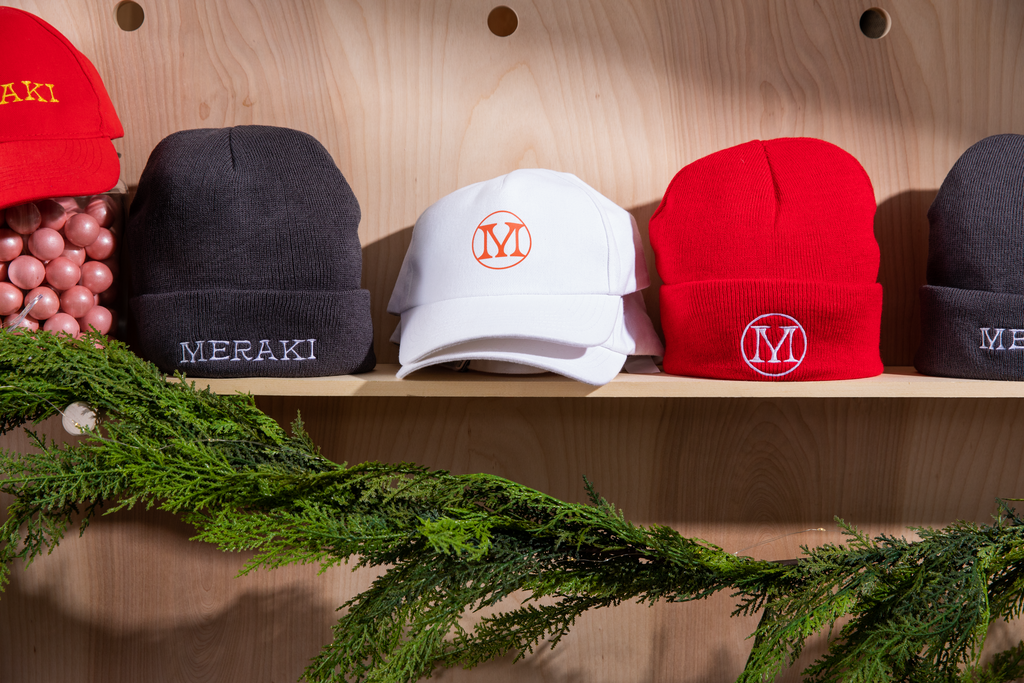 Branded hats on a shelf holiday gift basket ideas