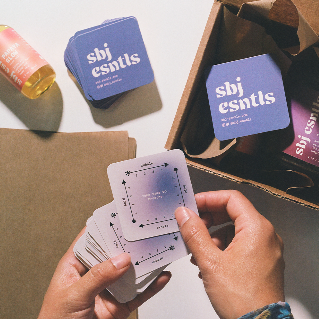 Purple branded round corner wellness business cards with consistent branding