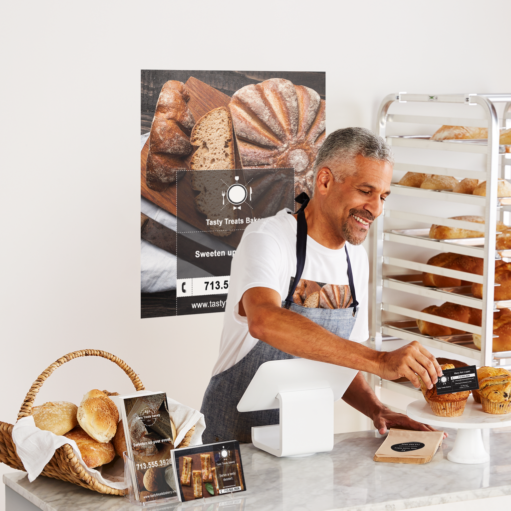 A man serving customers at a bakery with minimalism branding
