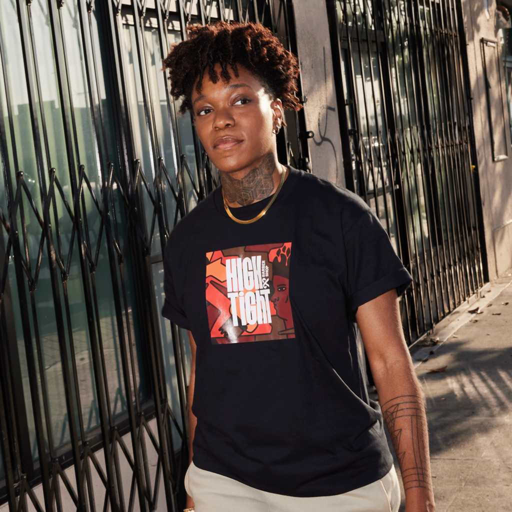 Small business owner wearing black T-shirt with a branded square graphic printed on the front