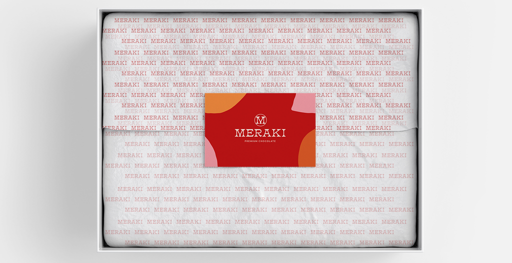 Product wrapped in branded tissue paper inside packaging