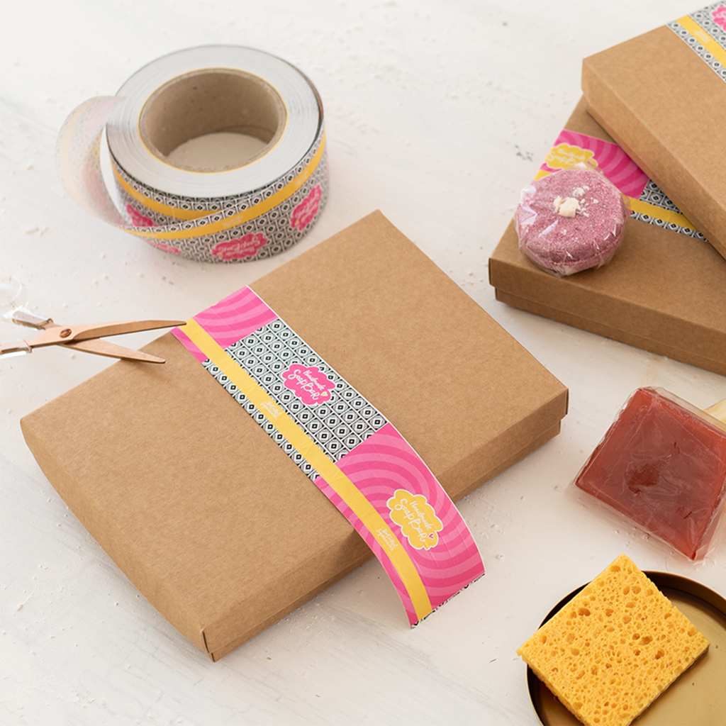 Cardboard box packaging with bright branded tape