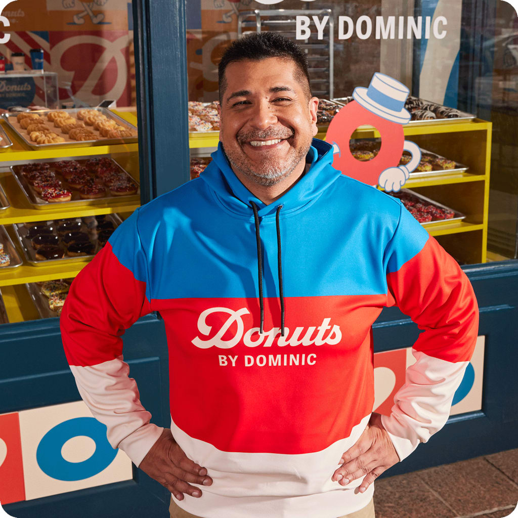 a man in a branded color block hoodie design