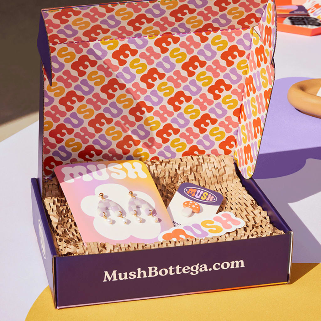 An example of branded packaging with packaging inserts and custom stickers