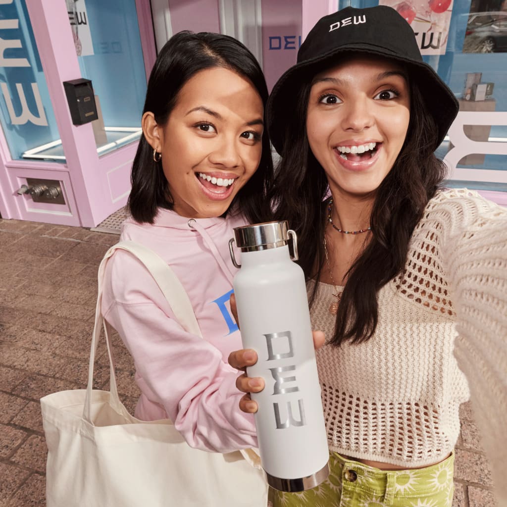 Loyal customers holding a branded water bottle strong brand positioning