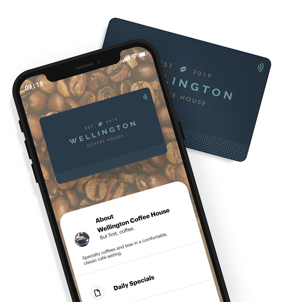A coffee house business card is shown behind a smart phone with the screen facing up and displaying business and menu details listed, all via NFC technology.
