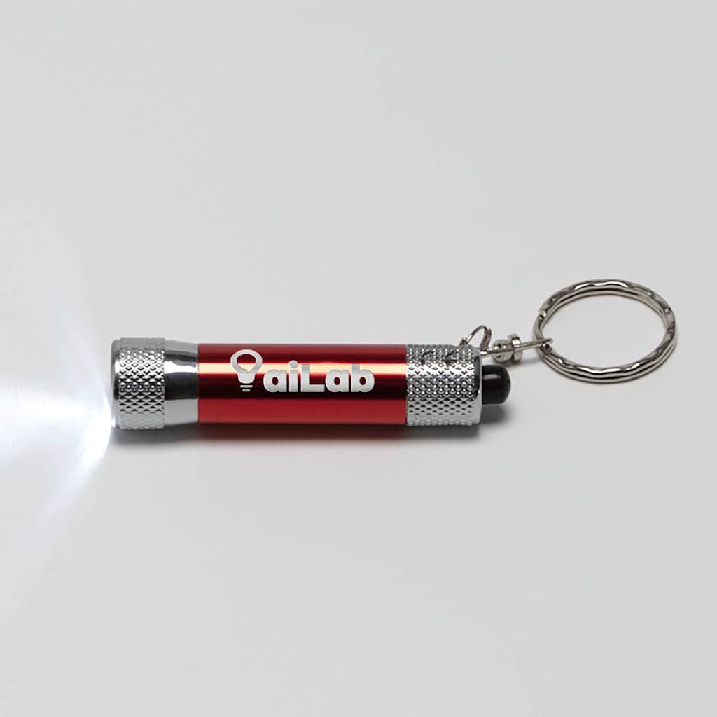 A keychain LED flashlight , laser engraved , promoting a business.
