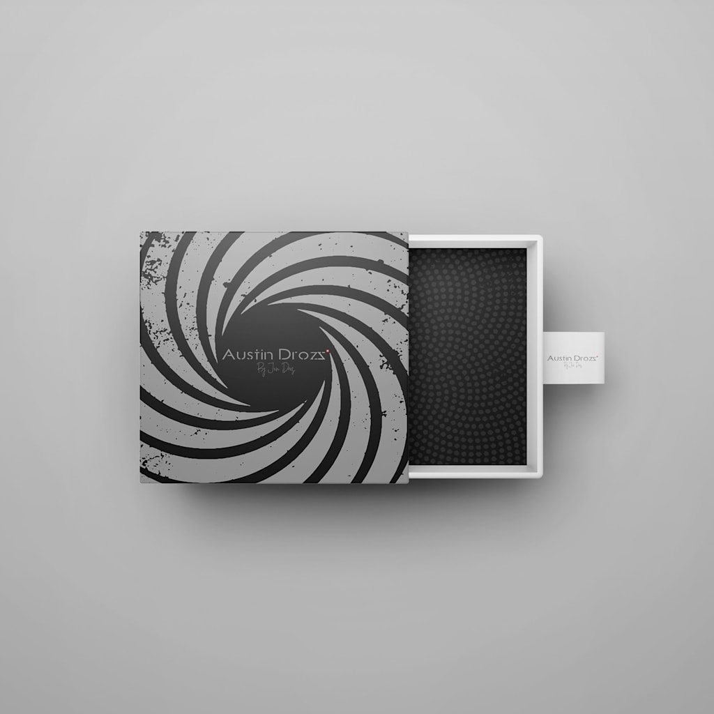 jewelry box with a slide-out interior and a gray and black spiral design on the top